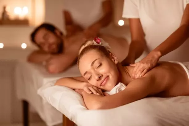 60 or 90 Min Couples Swedish or Hot Stone Massage Up to 50% Off